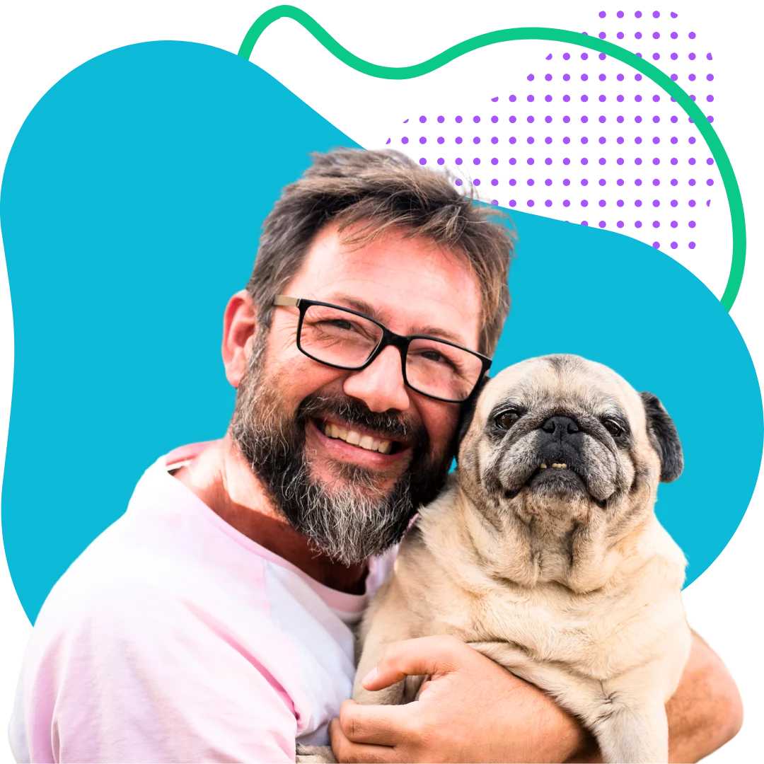 man holding his elderly pug with a colorful abstract background